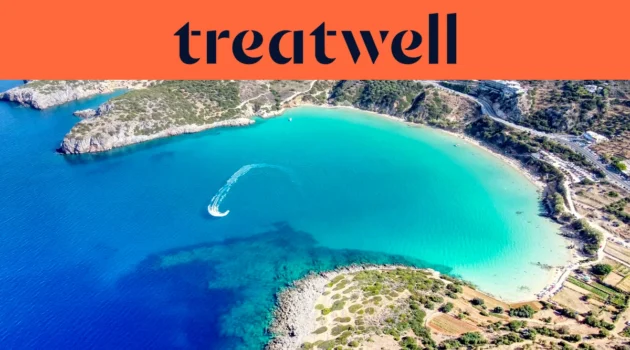 An aerial view of a turquoise Cretan bay, with a jet ski tracing a white curve through clear water, a crescent of sandy beach and dry hills around the shore, beneath a coral-orange banner reading treatwell.